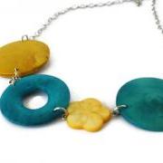 Chunky necklace in yellow and teal. Perfect spring and summer fashion. 